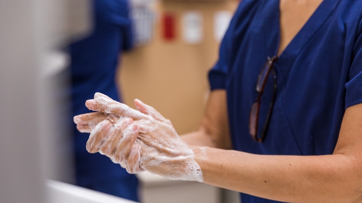 The doctor is rubbing