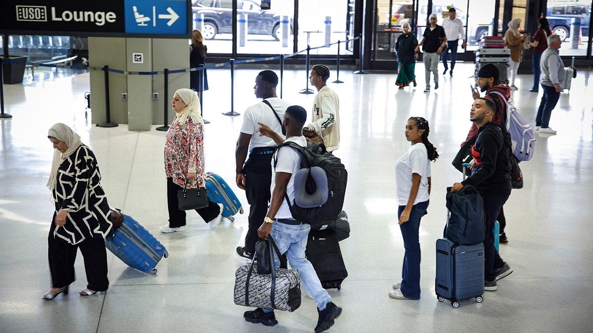 Passengers stroll through Newark Airport