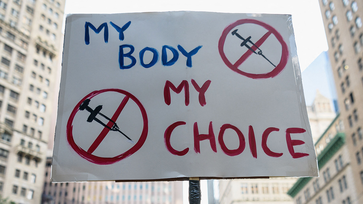 Protest sign: my body, my choice but protest of vaccines