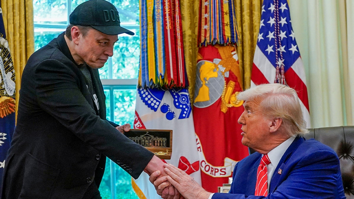 Elon Musk and Donald Trump shake hands with the oval office as the billionaire ends his time with the administration
