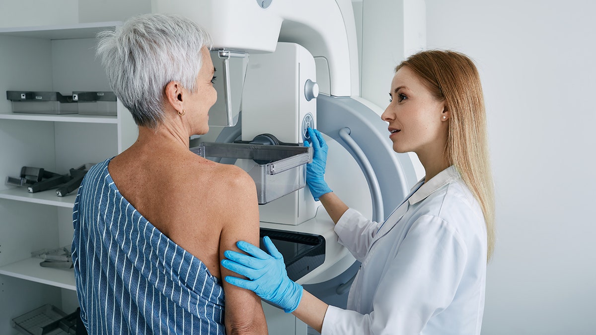 The older woman has mammogram